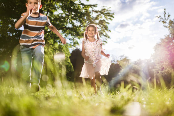 istock Beautiful children running in nature 1387630334