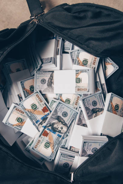 istock Bag full with money 1387630336
