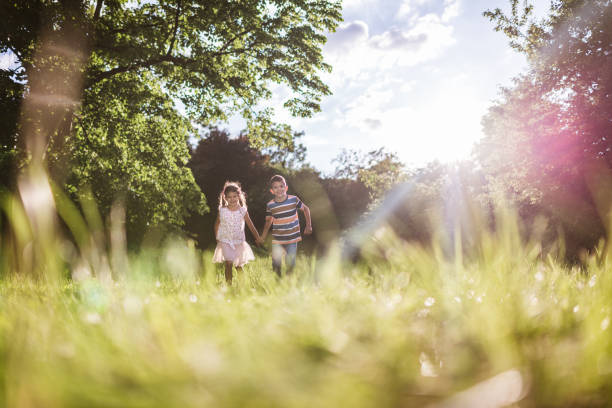 istock Beautiful children running in nature 1387630533