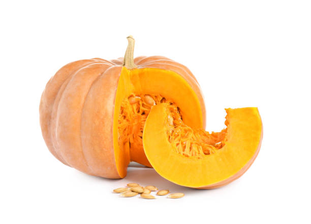 istock Cut ripe orange pumpkin and seeds on white background 1387630814