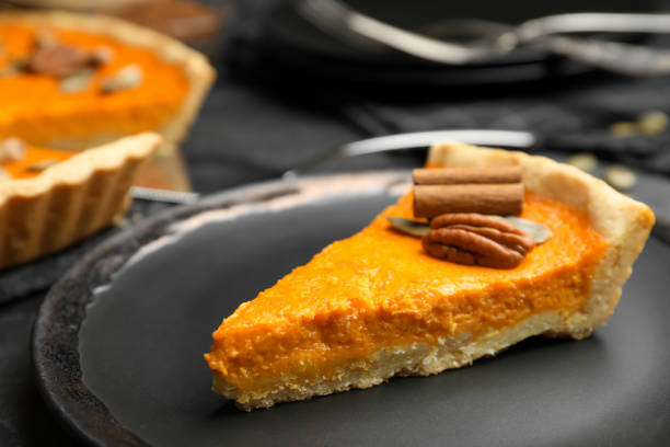 slice of delicious homemade pumpkin pie on plate, closeup - portion pumpkin vegetable black imagens e fotografias de stock