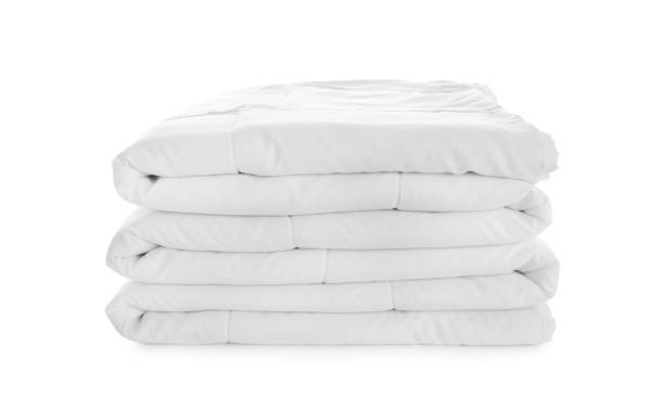 istock Folded clean blanket isolated on white. Household textile 1387631035