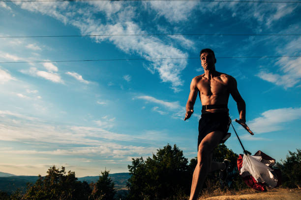 istock Young silhouette man exercise running outdoors keeping fit at mountain road on sunset 1387631191