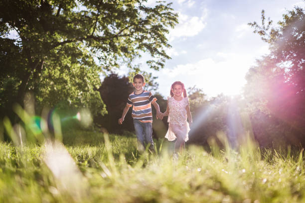 istock Beautiful children running in nature 1387632070