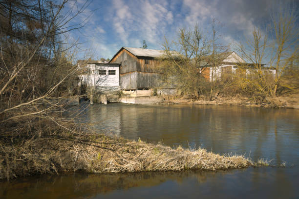 istock Landscape with a river and the setting sun. 1387634273