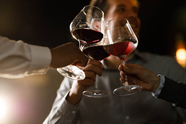 istock Close up of toasting with red wine. 1387635292