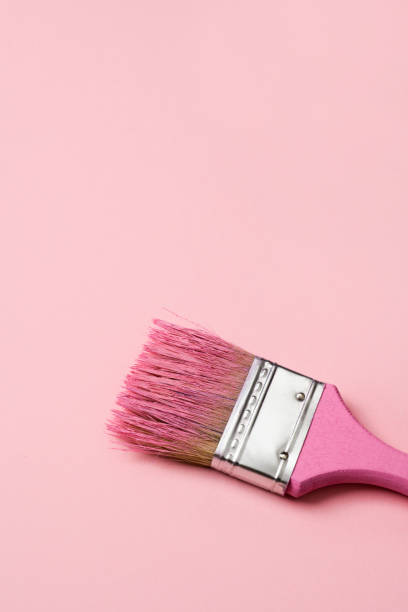 istock pink paint in a pink paintbrush 1387637528