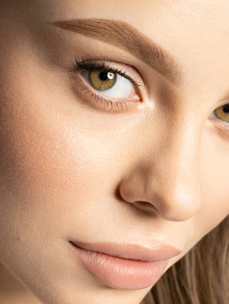 istock Beauty woman's face close up with corrected brows 1387639053
