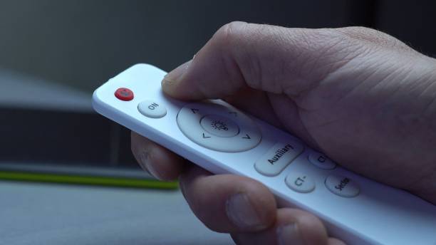 istock Turning on and off the light on the remote control 1387639935