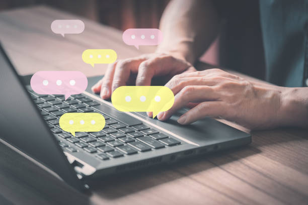 istock Man using laptop on wooden table . Business concept with live chat online on communication sites, digital media applications and social networks. 1387641541