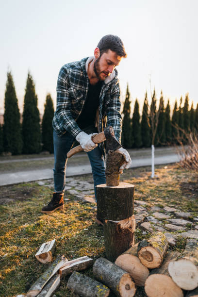 istock The man chopping firewood with an axe in the rural 1387645128