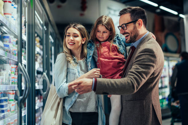 istock Parents and daughter shopping together 1387646468