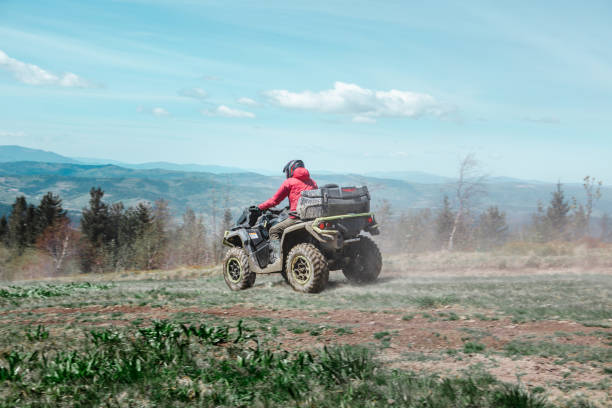driving by mountain road at all-terrain vehicle