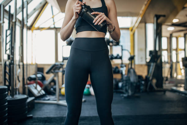 istock Young woman in gym 1387648263