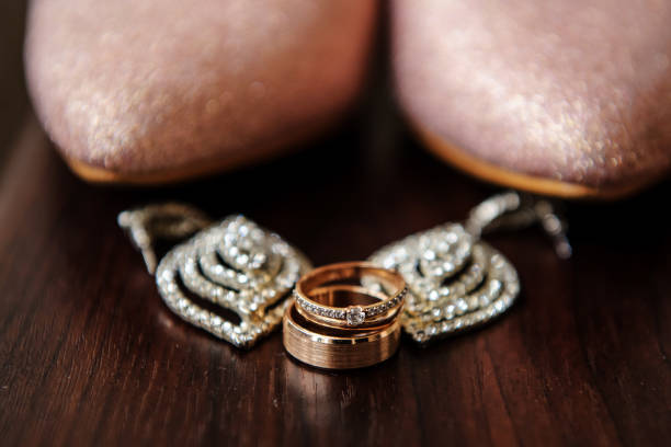 istock Close up wedding rings on the wood table 1387653413