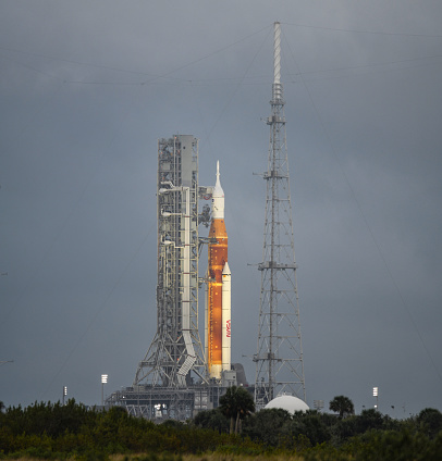 NASA Artemis 1 sits on launch pad 39B in April 2022 as part of the initial testing. Artemis 1 on the pad for initial wet dress testing that resulted in the original fuel leak issues. Shortly thereafter the SLS rocket was rolled back to the Vehicle Assembly Building (VAB) for repairs. Heat wave distortion is shown in lower portion of image (above the greenery) due to the distance and the heating of the day.