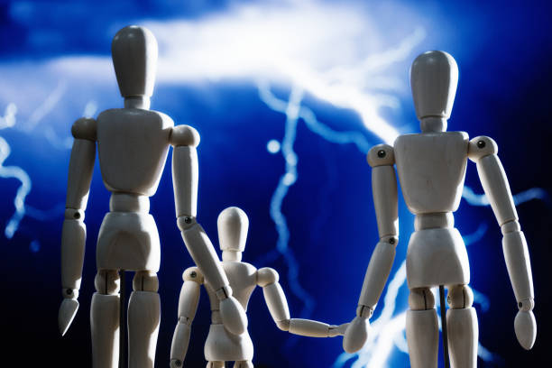 Heavy weather: three-person family looks at a dramatic, violent display of lightning.