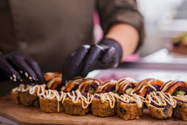 istock A female Vegan Sushi chef in a restaurant 1387663568
