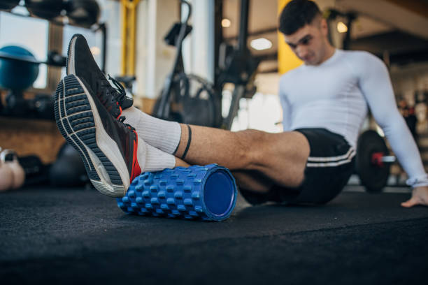 istock Man exercising in gym 1387663767