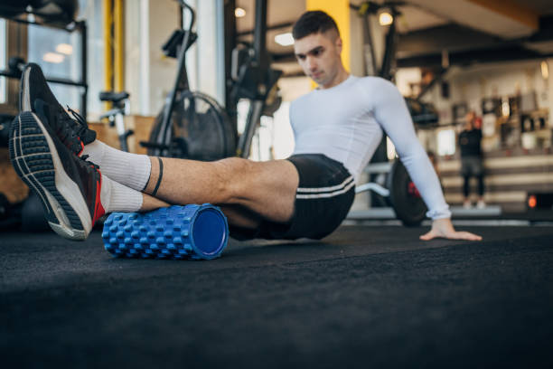 istock Man exercising in gym 1387663787