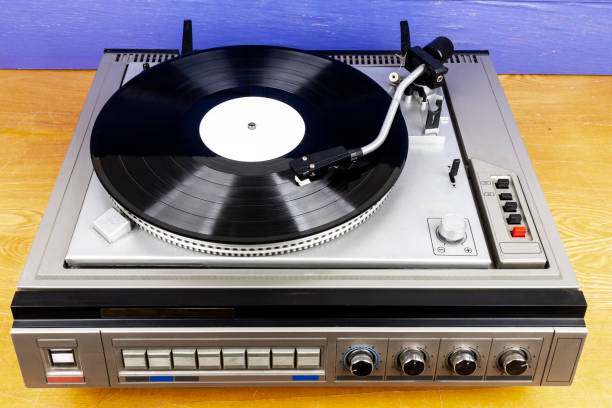 istock Vintage turntable vinyl record player with black vinyl 1387665133