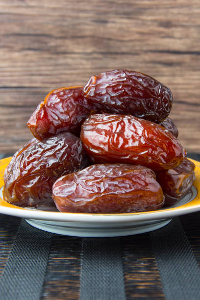 istock Delicious medjool dates ( kurma ) or sweet dried dates on a plate 1387667934