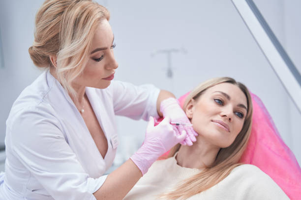 istock Dermatologist in nitrile gloves conducting mesotherapy procedure 1387668965
