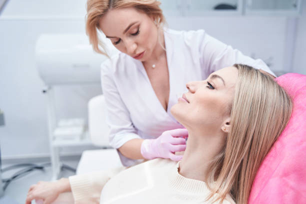 istock Experienced female doctor carrying out mesotherapy procedure 1387668984