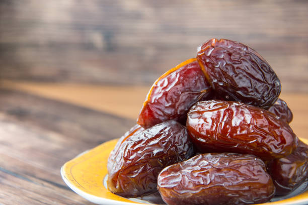 istock Delicious medjool dates ( kurma ) or sweet dried dates on a plate 1387669312