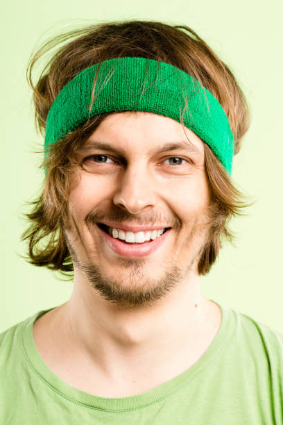 istock Shot of a handsome young man standing alone in the studio and posing while wearing a headband 1387670990