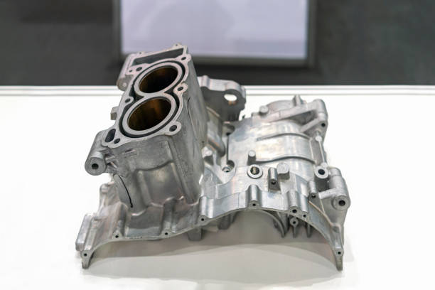 aluminum or alloy engine cylinder block for automotive part from high pressure die casting manufacturing process on table aluminum or alloy engine cylinder block for automotive part from high pressure die casting manufacturing process on table engine casting stock pictures, royalty-free photos & images
