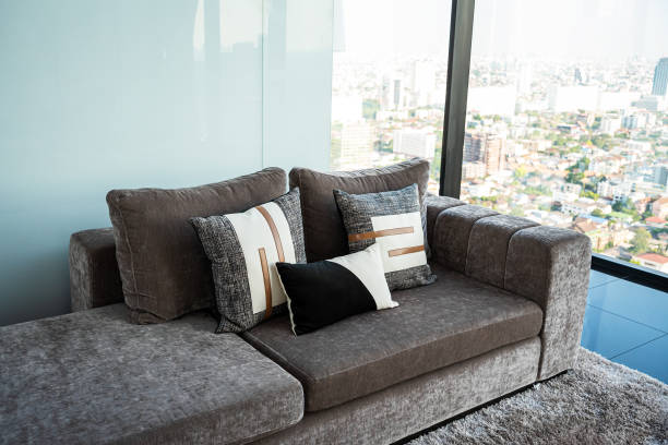 istock Room design interior with sofa and pillows 1387676753