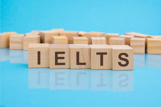 istock IELTS - text of on wooden cubes, reflected from the bright blue surface 1387679416