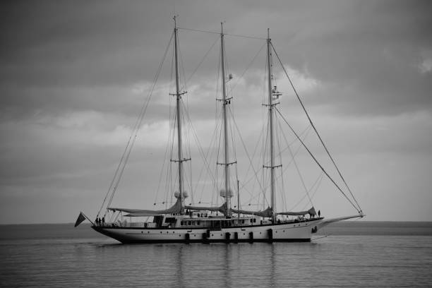 A sailboat in the middle of the sea with tranquillity and dignity