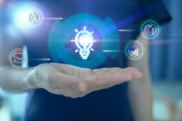 istock Woman hand holding virtual light bulb idea icon connect and process to roadmap. 1387681634