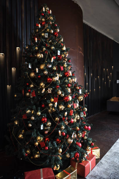 istock Interior christmas. magic glowing tree, fireplace and gifts. 1387682847
