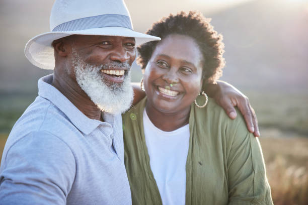 istock Loving mature couple laughing while enjoying a day together outdoors in summer 1387683234