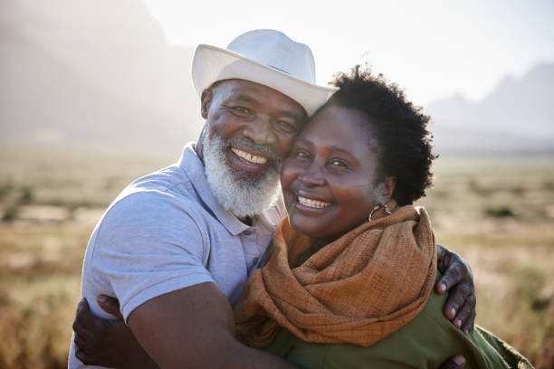 istock Smiling mature couple hugging each other outside in summer 1387685048
