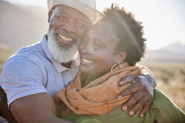 istock Affectionate mature couple hugging each other outside in nature 1387685117