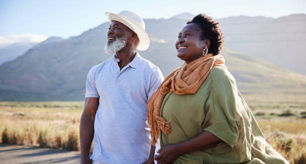 istock Mature couple enjoying the scenic view during a day outdoors in nature 1387685204