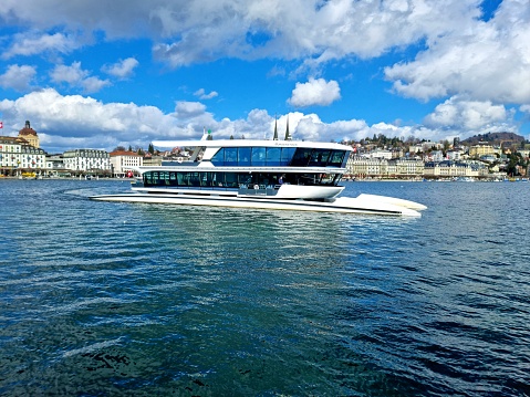 The hybrid motor vessel Bürgenstock had its Maiden Voyage in  Late spring 2018. The ship has a Total length of 38 m and a width  of 10.30. The image was captured at Lakre Lucerne next to Lucerene City.