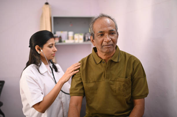 istock Female doctor examining patient with stethoscope 1387686478
