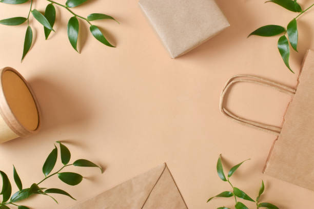 istock A frame made of paper and leaf packaging on a beige background. 1387686758