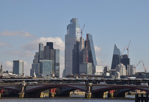 London, UK - March 18 2022: City of London skyscrapers and Blackfriars Railway Bridge,  daytime view