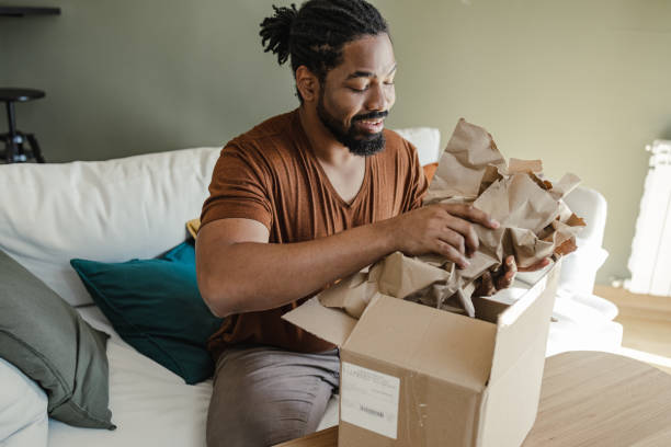 istock Package delivery and unpacking of ordered items at home 1387696352
