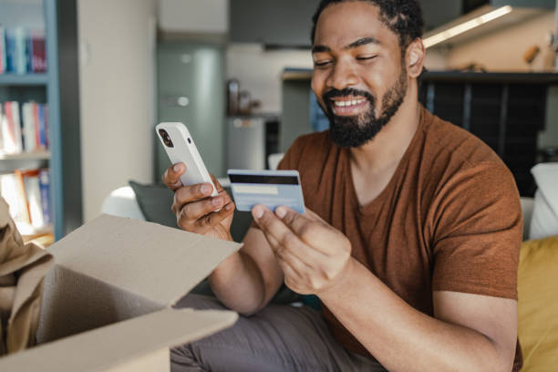 istock Man satisfied with his online purchase decided to repeat a purchase 1387696971