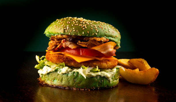 istock st patricks day - crispy chicken bacon burger with green bread and potatoes 1387699544