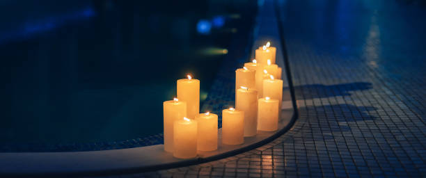 istock Relaxing spa background with candles near the pool in the evening 1387700749