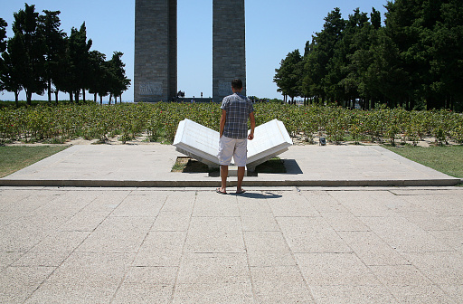 Canakkale, Turkey - July 28, 2012: People at Turkish cemetery for soldiers who death at from First World of War of the battle of Gallipoli in Canakkale, Turkey.