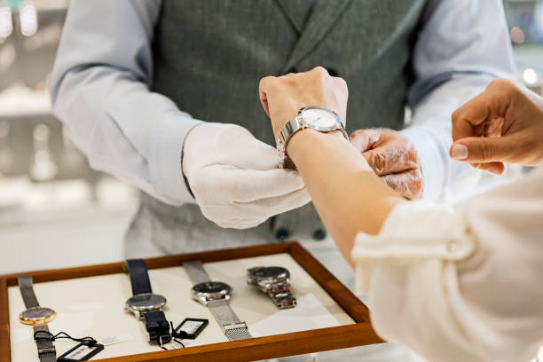 istock Young woman trying on a wristwatch 1387702944